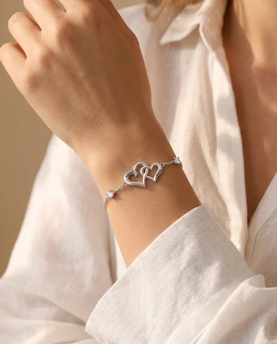 Personalised double heart bracelet worn with a denim jacket