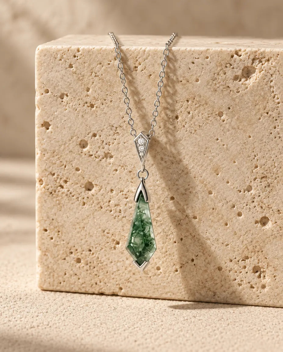 Moss Agate Jewellery Set - displayed on a travertine block