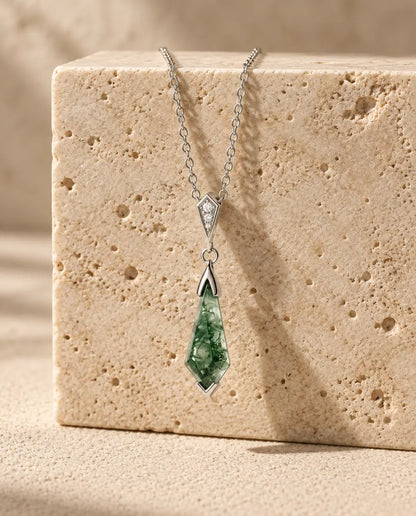 Moss Agate Jewellery Set - displayed on a travertine block