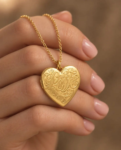 Personalised Photo Locket Necklace That Holds 2 Pictures - Love Script Heart Locket With Mother of Pearl Back held in hand