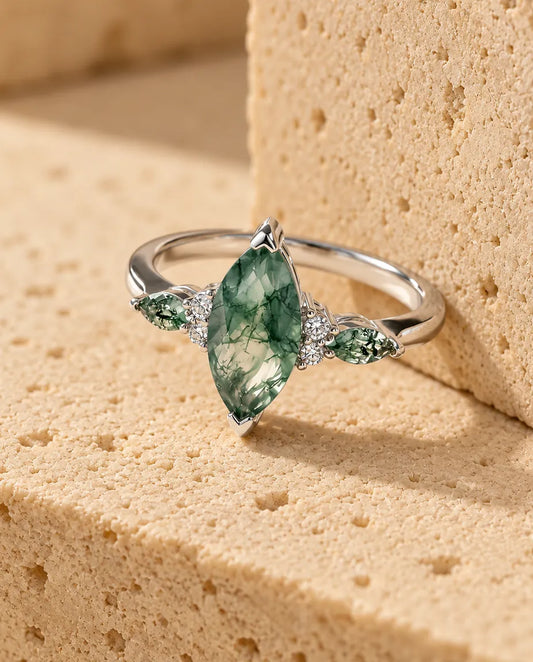 Moss Agate Ring - displayed on a travertine block