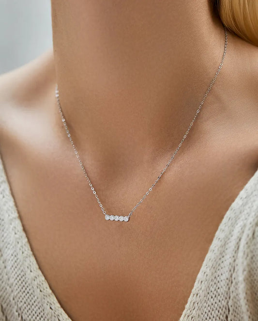 Moissanite bar necklace in 925 sterling silver, five D colour bezel-set stones, curved pendant for women