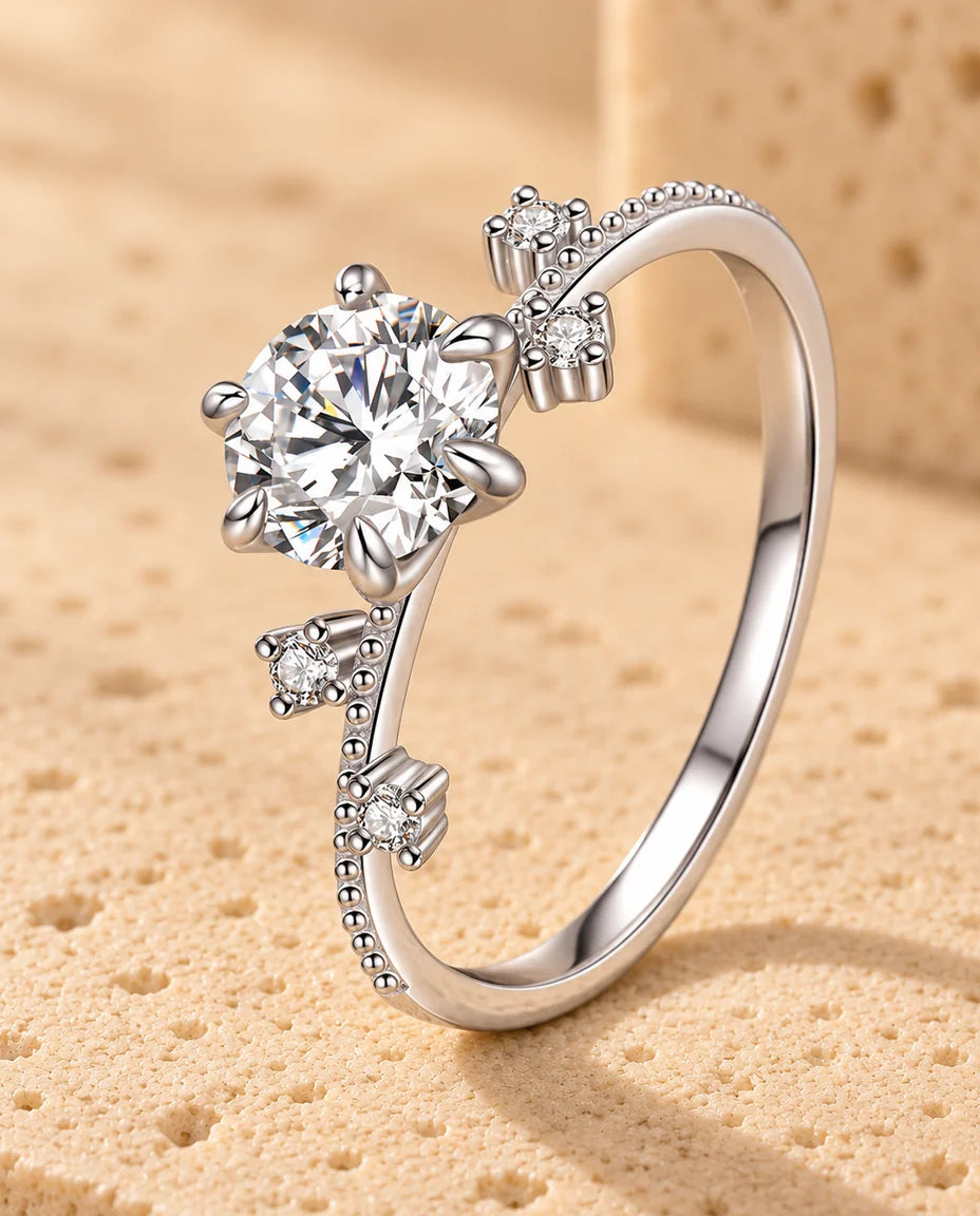 Moissanite Engagement Ring - displayed on a travertine block