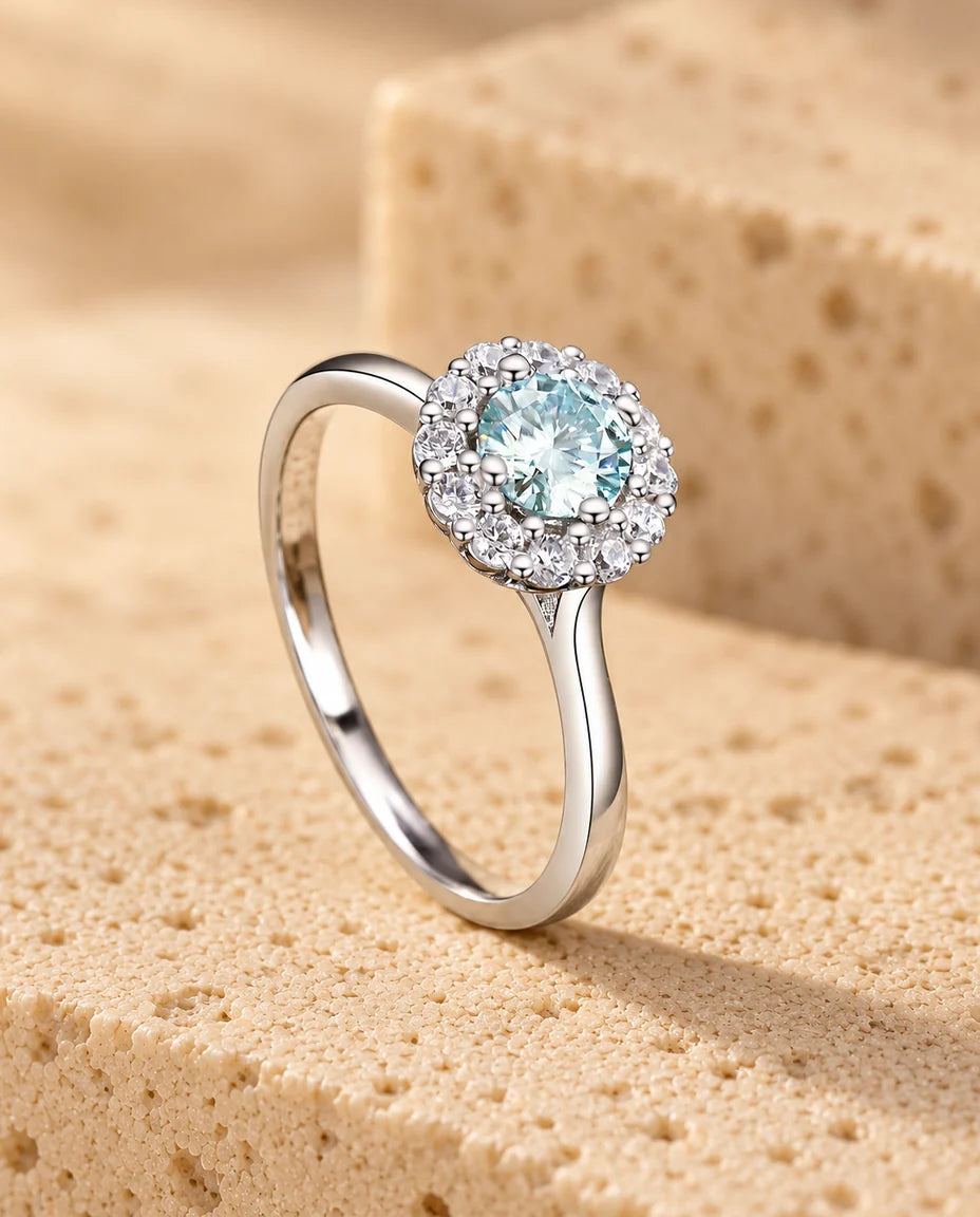 Moissanite Halo Ring - displayed on a travertine block