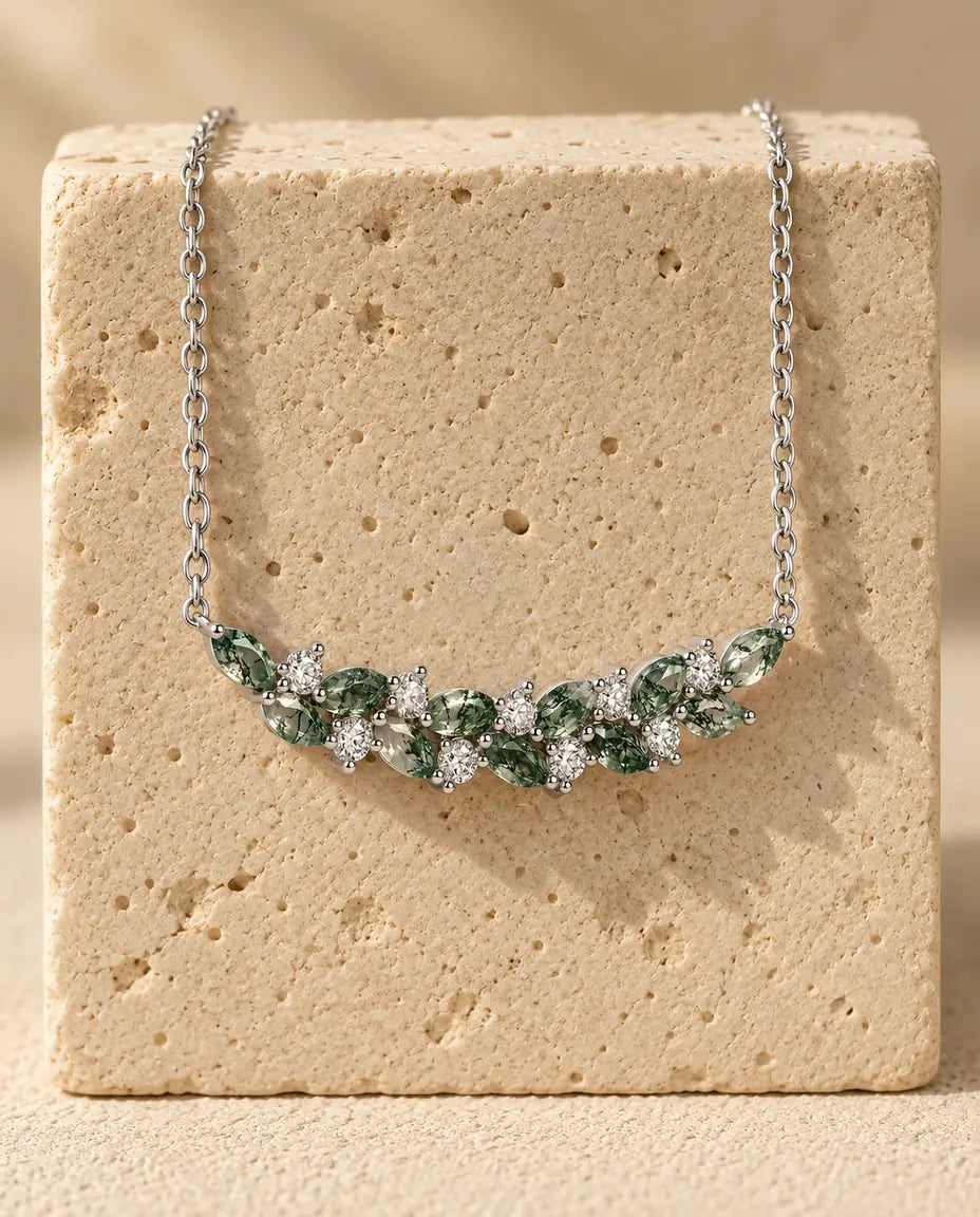 Moss Agate Necklace - displayed on a travertine block