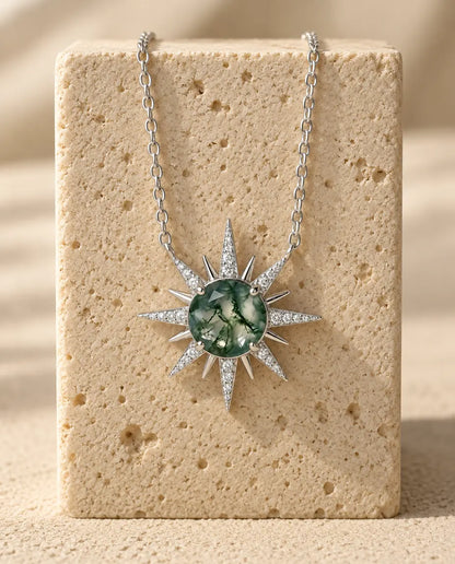 Moss Agate Necklace - displayed on a travertine block