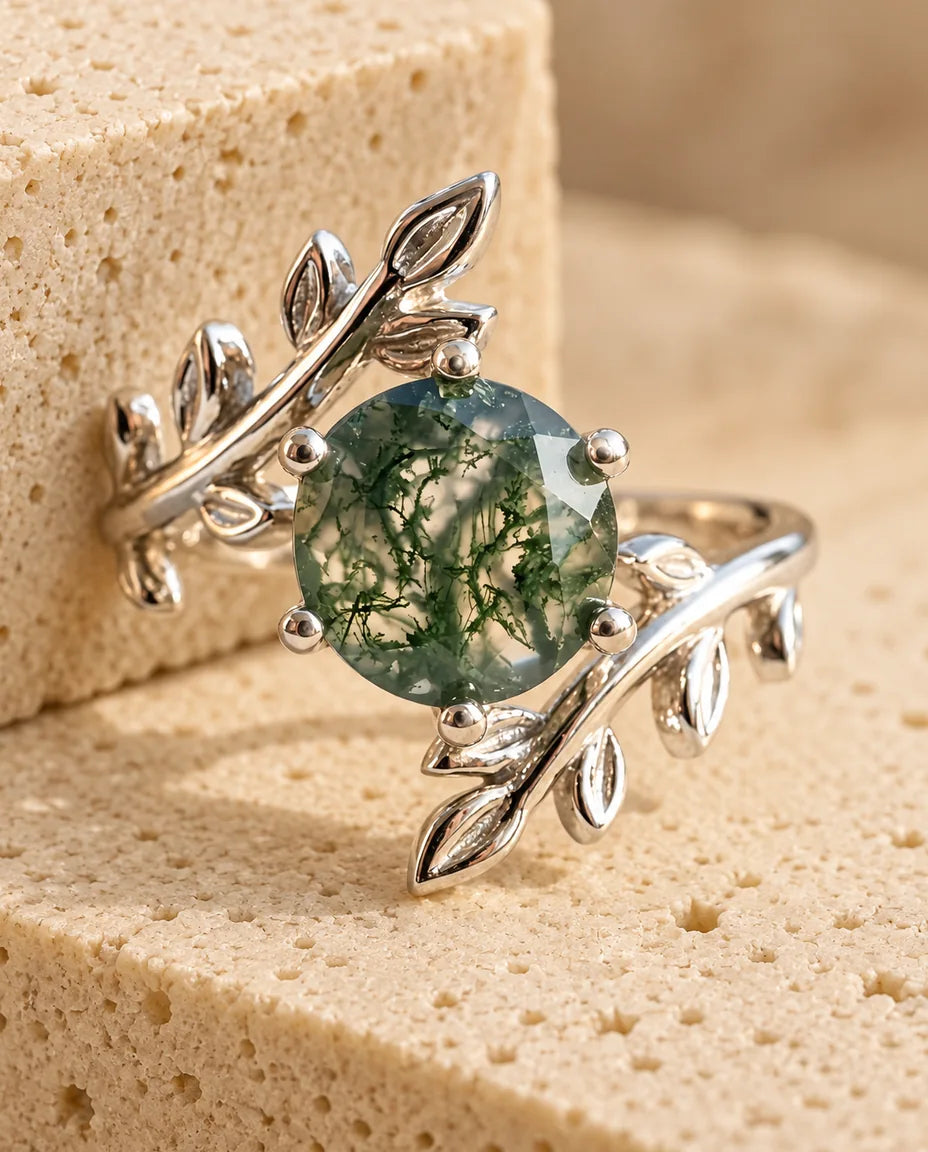 Leaf Moss Agate Ring - displayed on a travertine block