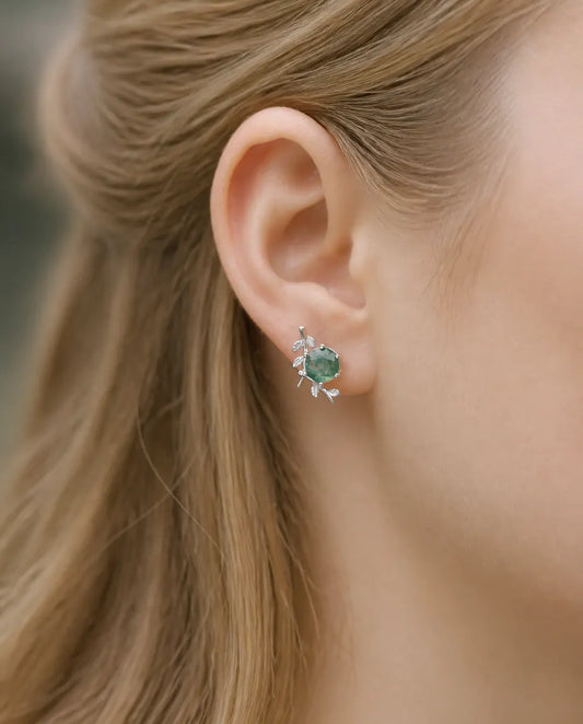 Round moss agate stud earrings with a leafy silver twig