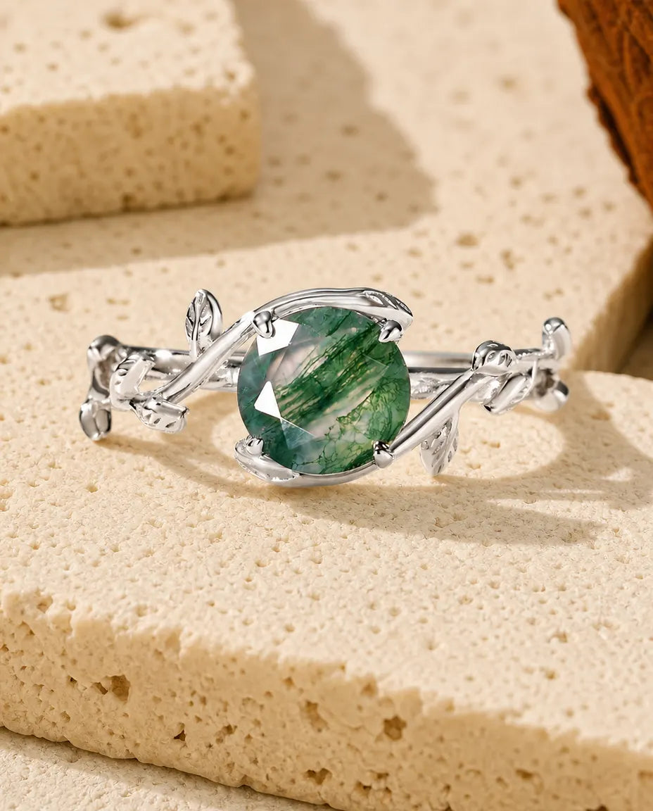 Moss agate vine leaf adjustable ring in sterling silver with round rose-cut stone and sculpted leaf band