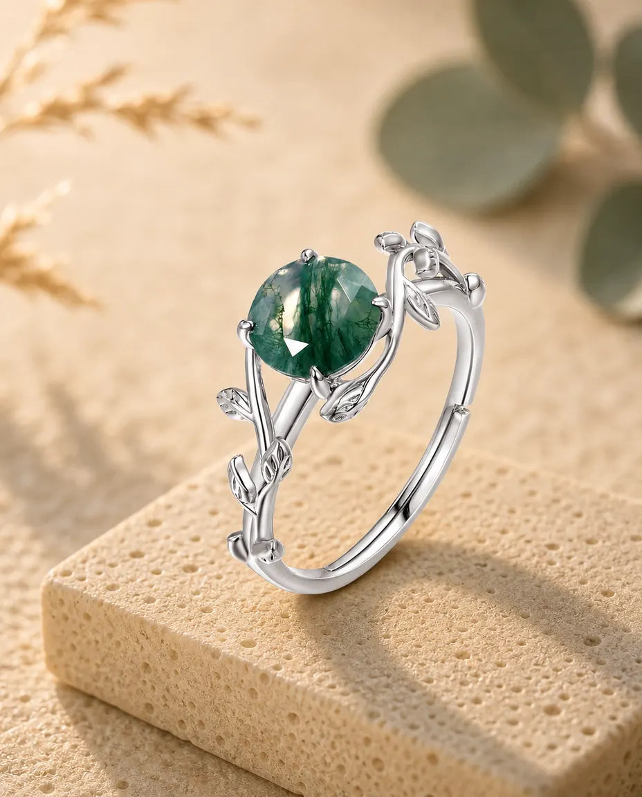 Moss agate vine leaf adjustable ring in sterling silver with round rose-cut stone and sculpted leaf band