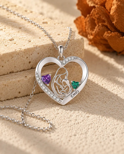 Mother and child heart necklace photographed from a low angle