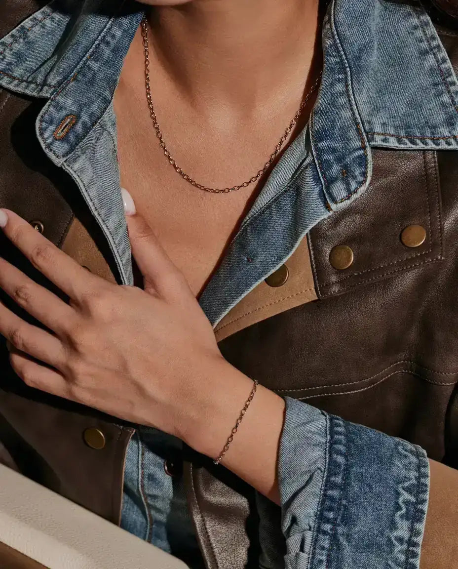Oval Link Chain Necklace in 925 Sterling Silver - worn on a model, hand resting on the chest