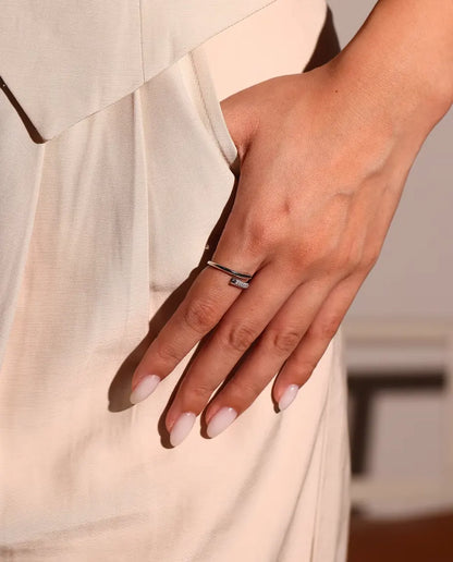 Pave Moissanite Bypass Ring in 925 Sterling Silver - worn on a hand resting at the hip