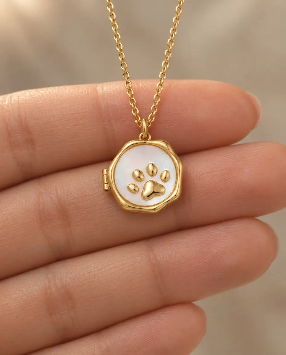 Personalised Paw Print Photo Locket Necklace That Holds 2 Pictures held in hand