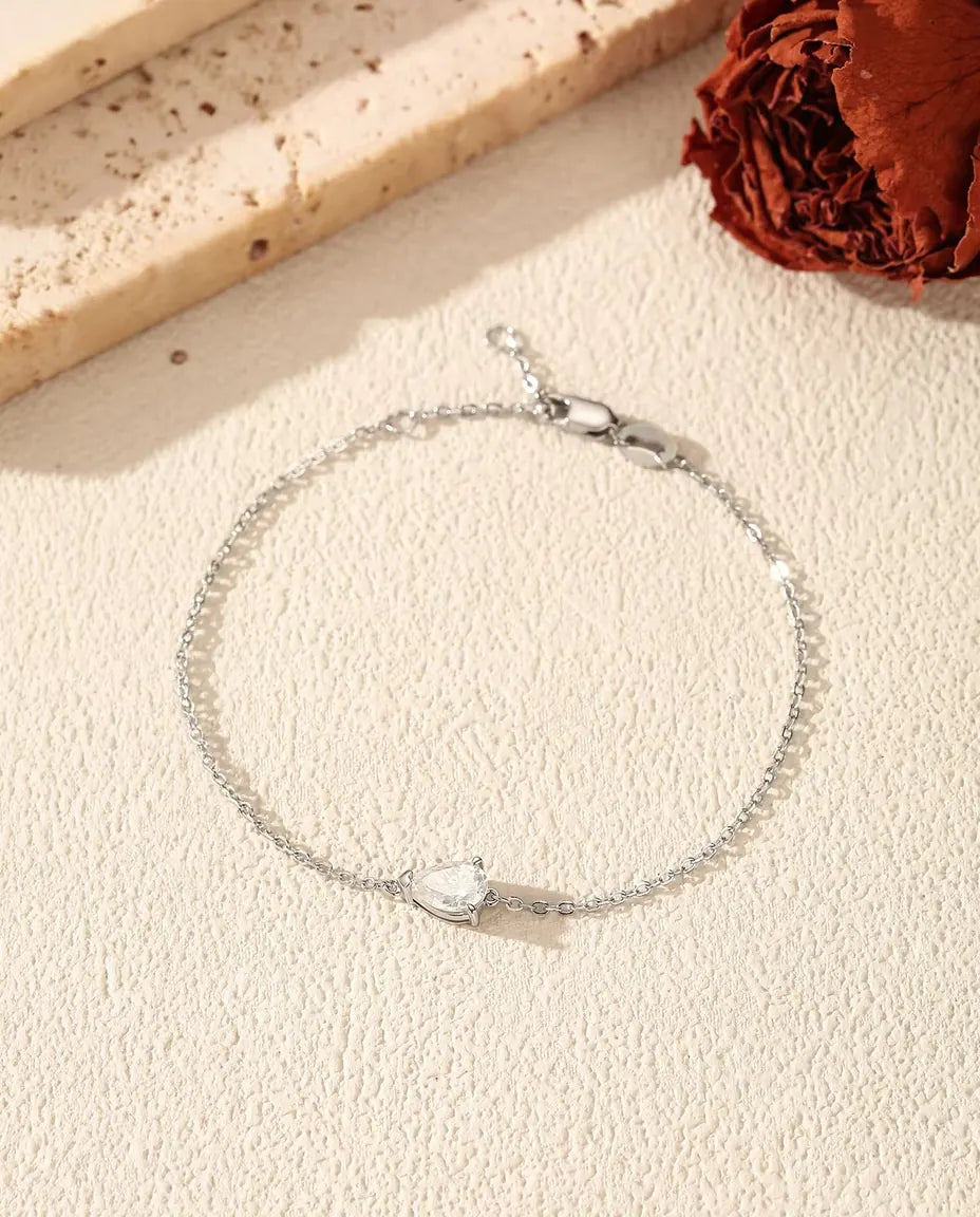 Pear cut moissanite bracelet in 925 sterling silver on a dainty chain