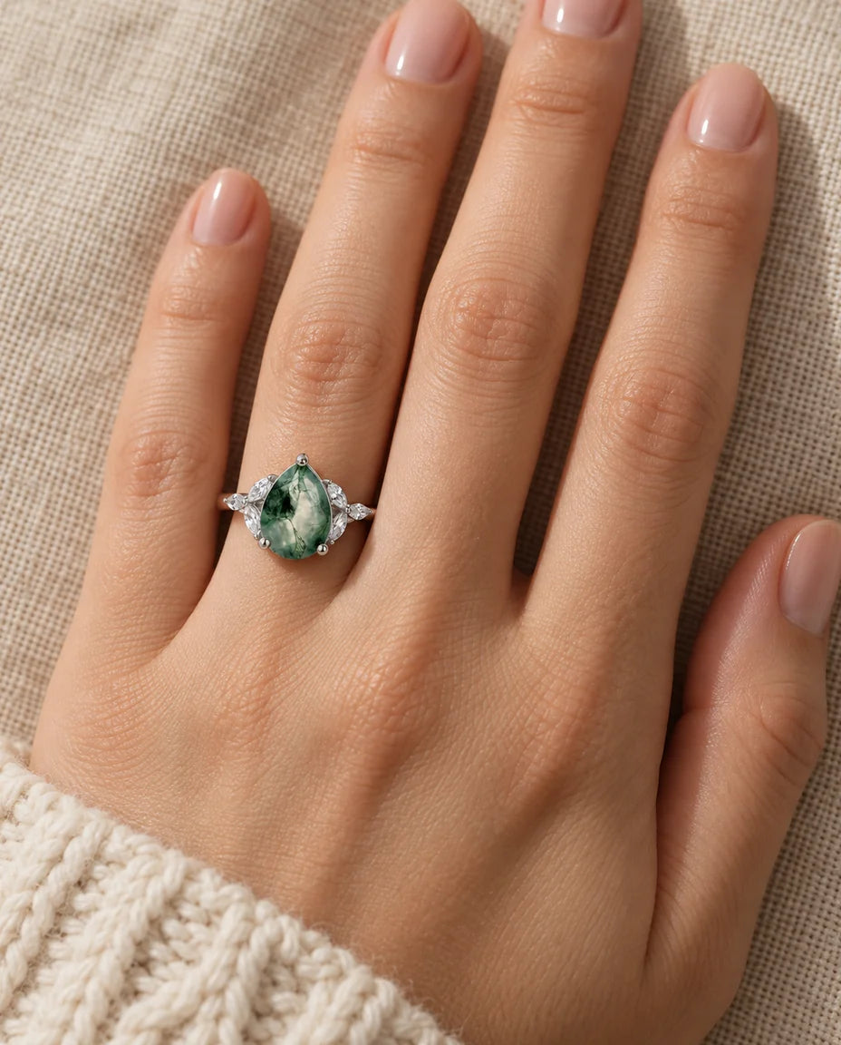 Pear-Shaped Moss Agate Engagement Ring - worn on the hand, close-up