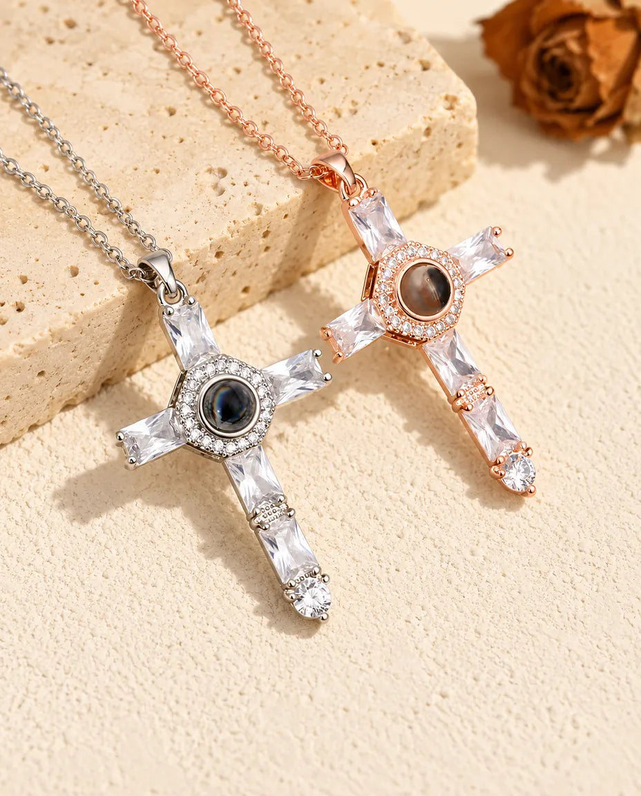 Silver tone and rose gold tone cubic zirconia cross necklaces on travertine