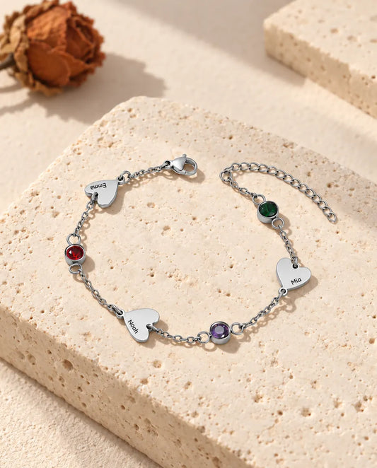 Personalised heart name bracelet with three engraved hearts and three birthstones in stainless steel