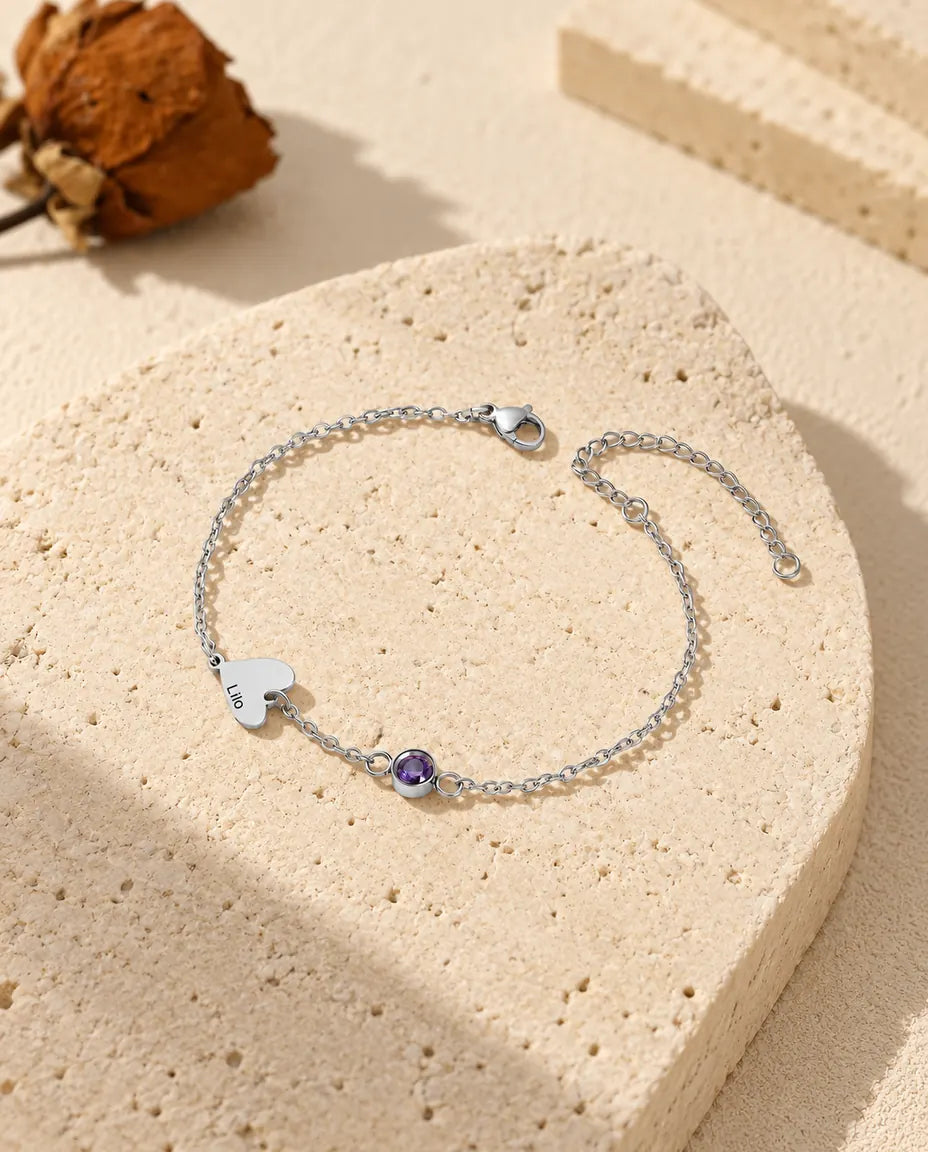 One-name heart bracelet with a single engraved heart and a purple birthstone