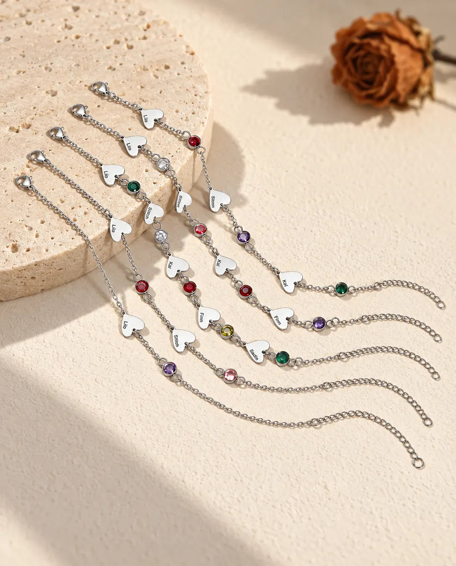 Six heart name bracelets side by side with different numbers of hearts and birthstones