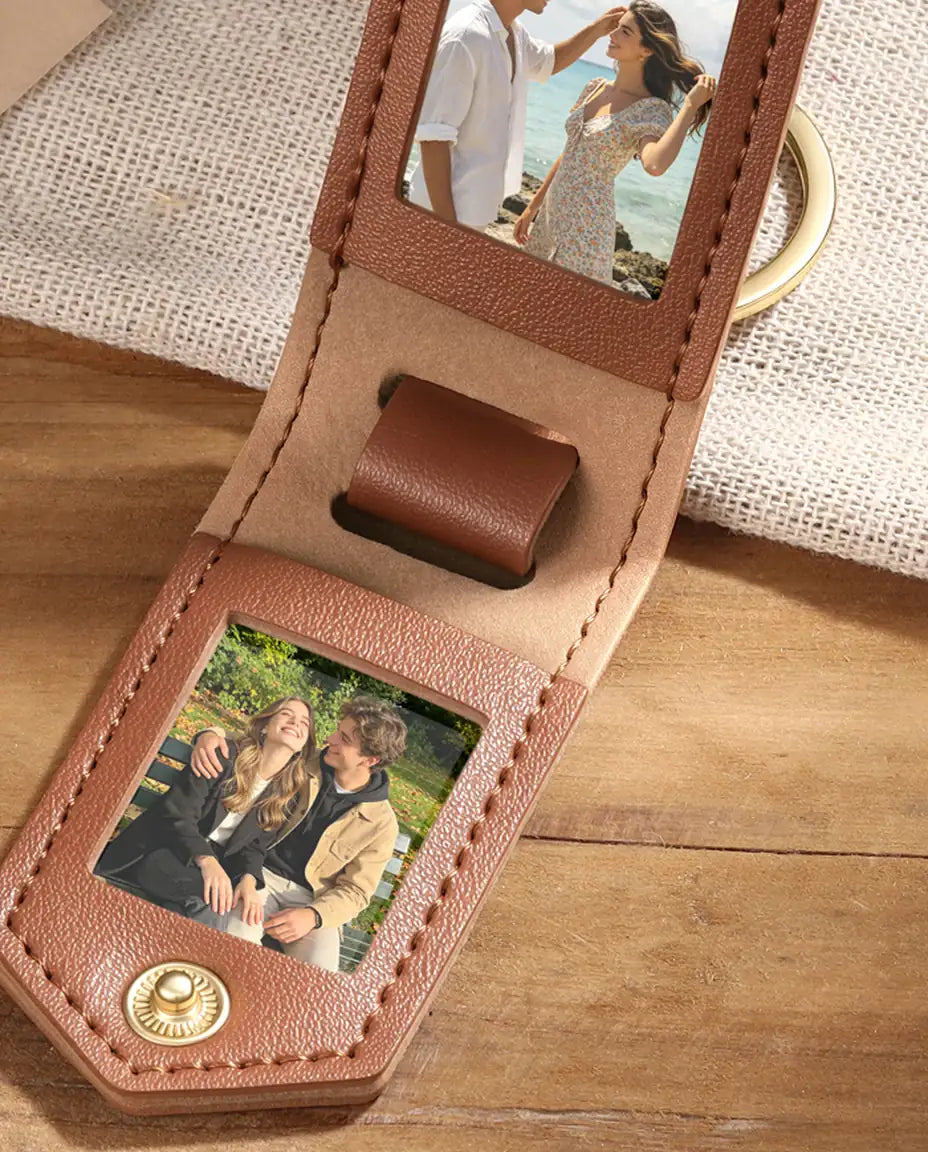 Close-up of brown faux leather photo keyring showing two photo frames and stitching