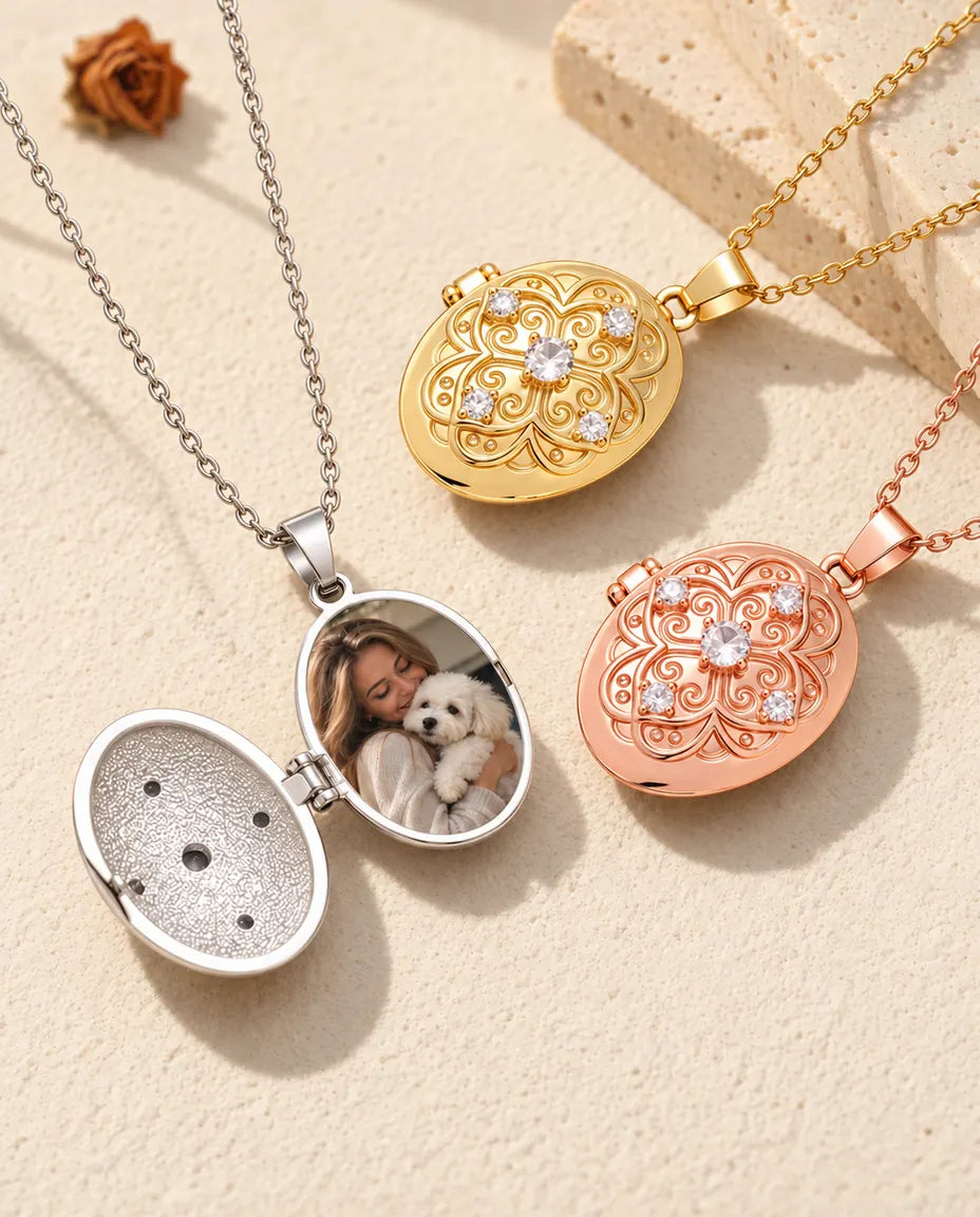 Silver oval locket opened to show a family photo inside, next to closed gold tone and rose gold tone lockets