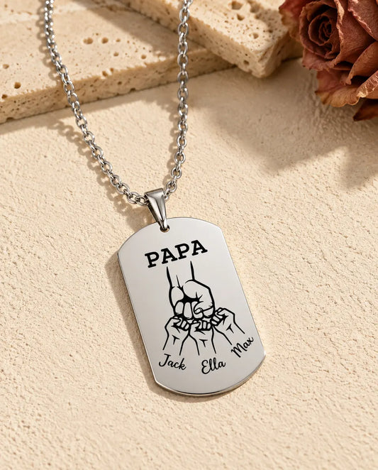 Back of the papa dog tag engraved with PAPA, fist bumps and three kids' names