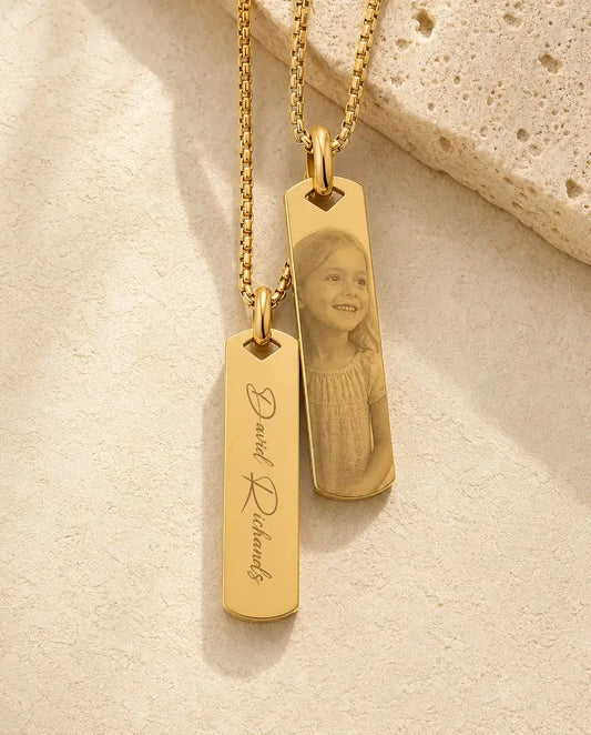 Back of the gold bar engraved with a name, photo-etched front behind it