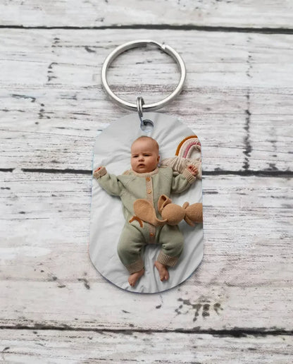 Photo keyring on a rustic wood surface