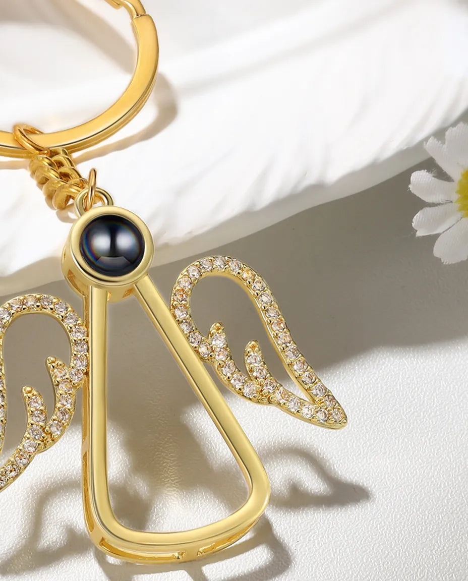Close-up of the projection bead and pavé crystal wings on the angel keyring