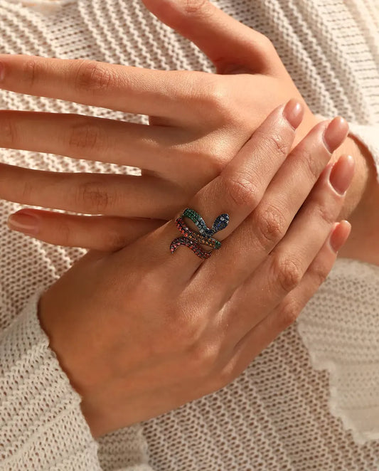 Snake Ring in 925 Sterling Silver with Rainbow Coloured Stones - worn on a model’s hand