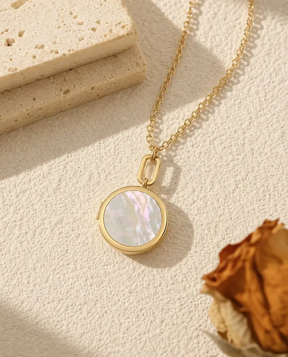 Gold round mother of pearl photo locket necklace on a paperclip link