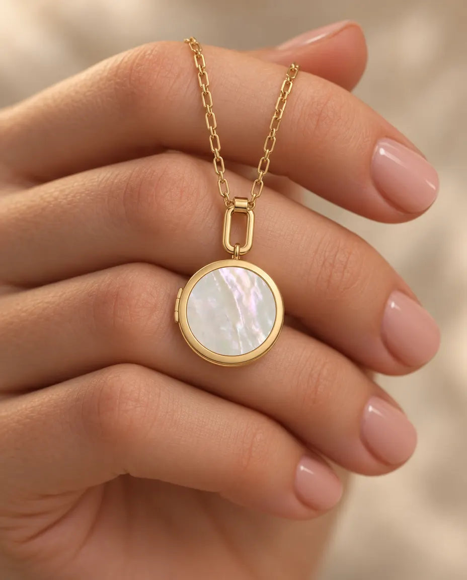 Personalised Round Photo Locket Necklace That Holds 2 Pictures held in hand