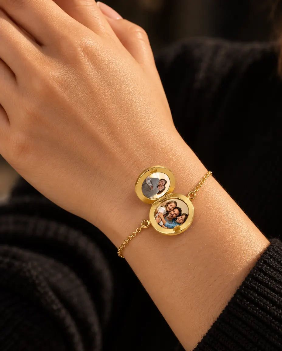 Woman wearing the round locket bracelet open, showing two photos