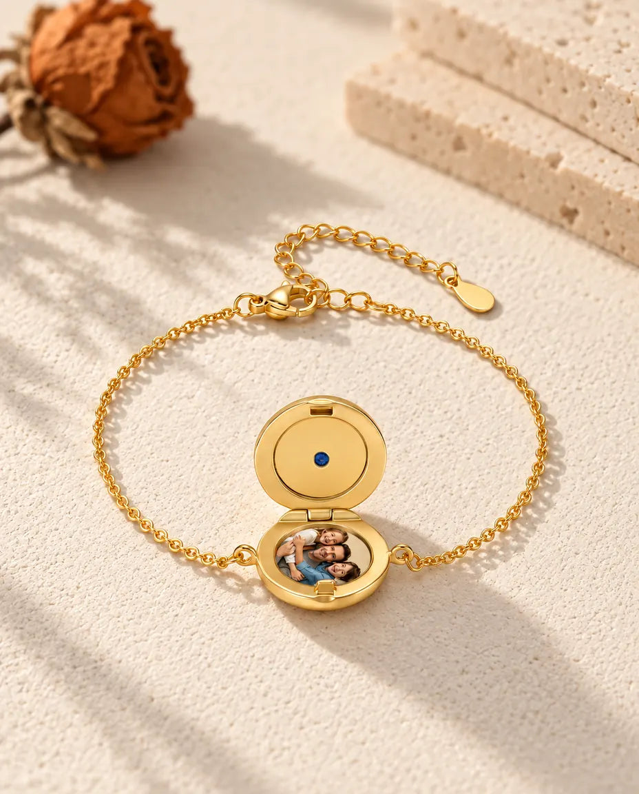 Open round locket bracelet with one photo, seen from a low angle