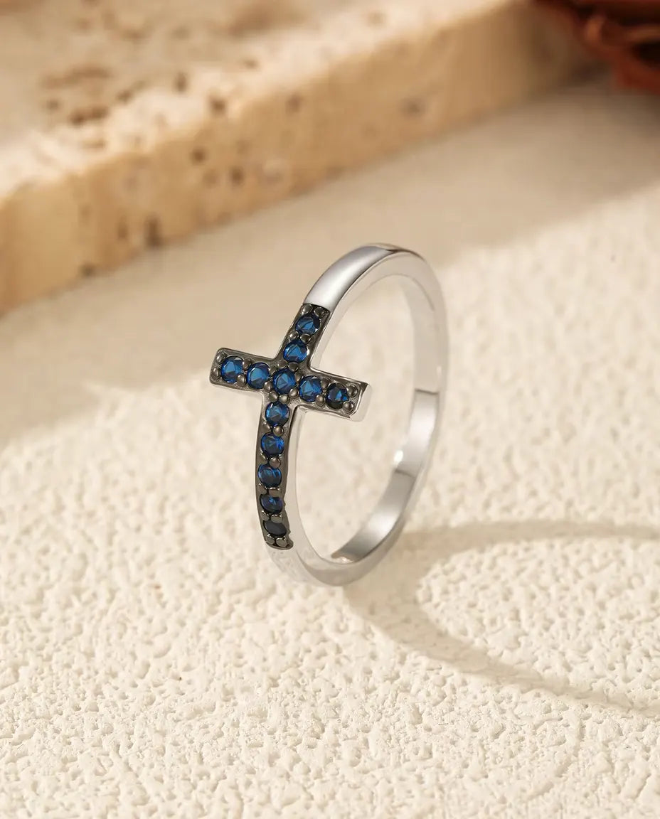 Sideways cross ring with blue zirconia pave in 925 sterling silver