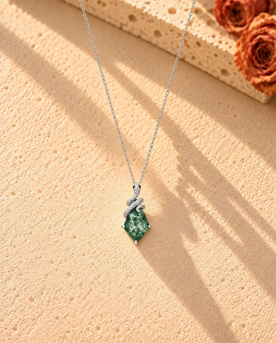 Snake Moss Agate Necklace in 925 Sterling Silver - the whole necklace laid out in a long V on a cream textured surface