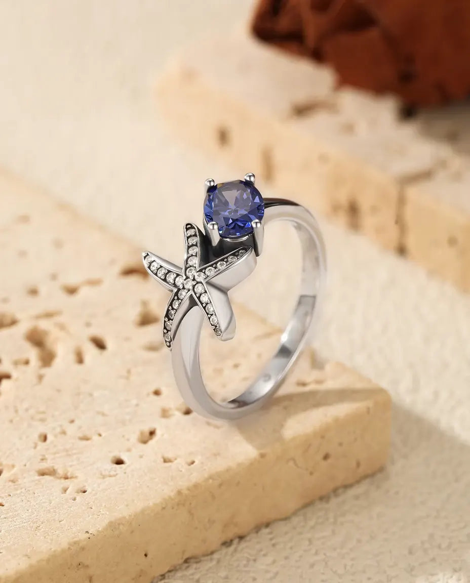 Starfish ring with oval violet zirconia in 925 sterling silver