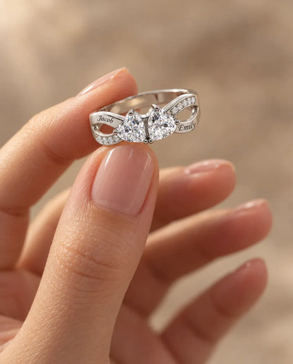 Heart Birthstone Name Ring - held between the fingers