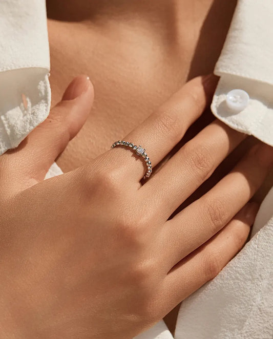 Teardrop moissanite ring on adjustable beaded sterling silver band