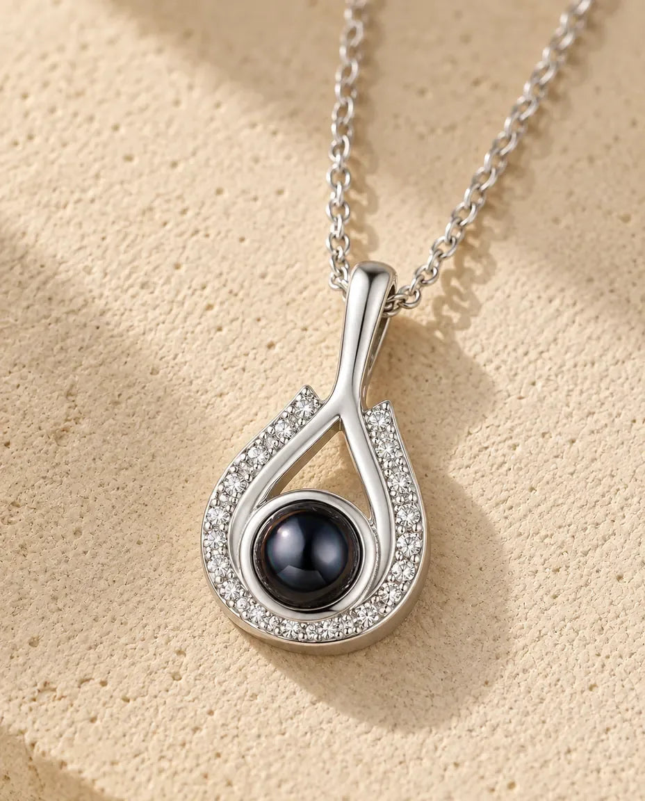 Personalised Teardrop Photo Projection Necklace in Silver - close-up of the projection charm