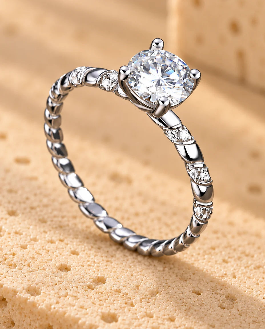 Moissanite Engagement Ring - displayed on a travertine block