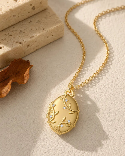 Personalised vine and crystal oval photo locket necklace holding two pictures, gold