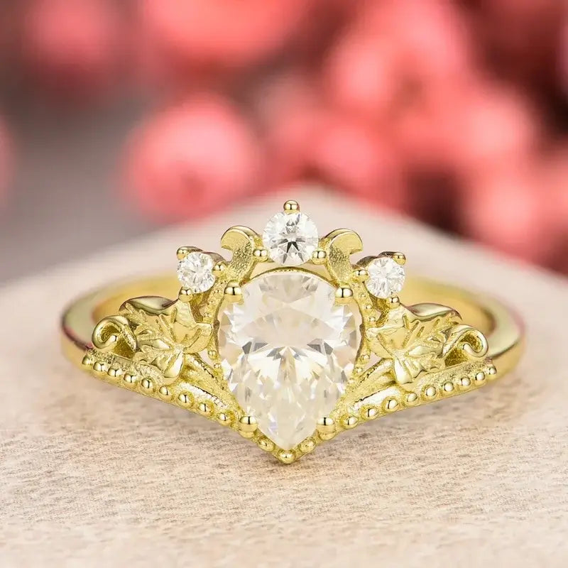 18ct White Gold 1ct Total Diamond Pear Cut Halo Ring | Ernest Jones