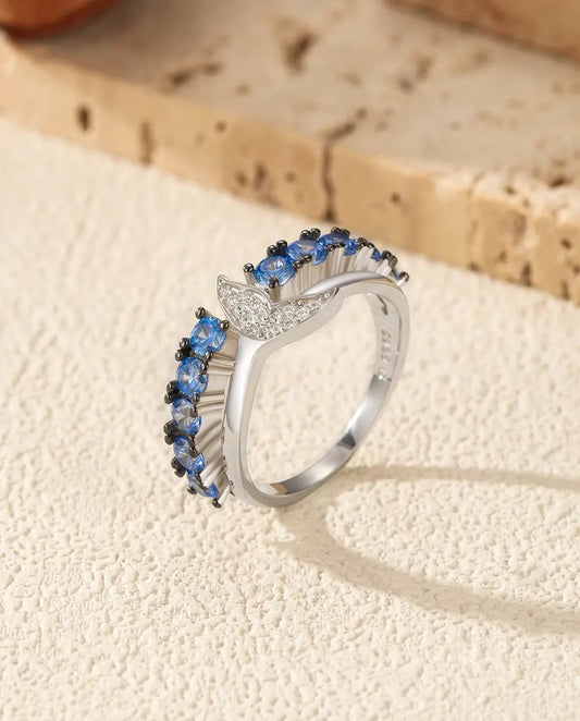 Whale tail ring with blue and white zirconia in 925 sterling silver