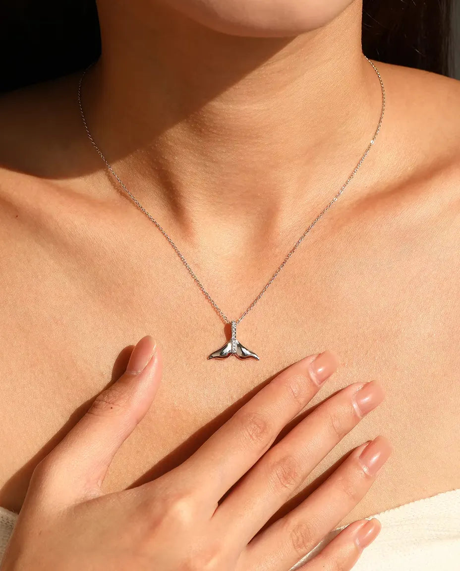 Whale tail pendant necklace in 925 sterling silver with a pave set bail