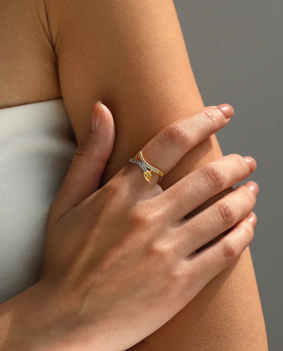 Yellow pear cut bypass ring in 925 sterling silver with two tone pave bands